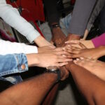 Group of people holding hands
