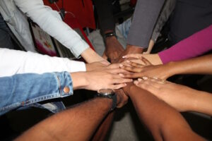 Group of people holding hands